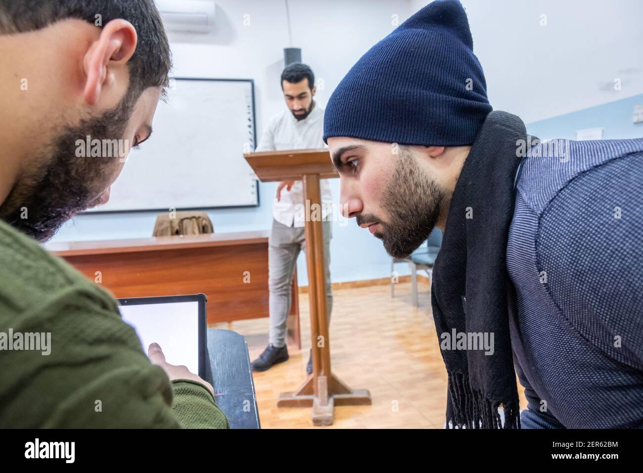 Arabic students discussing things in class Stock Photo