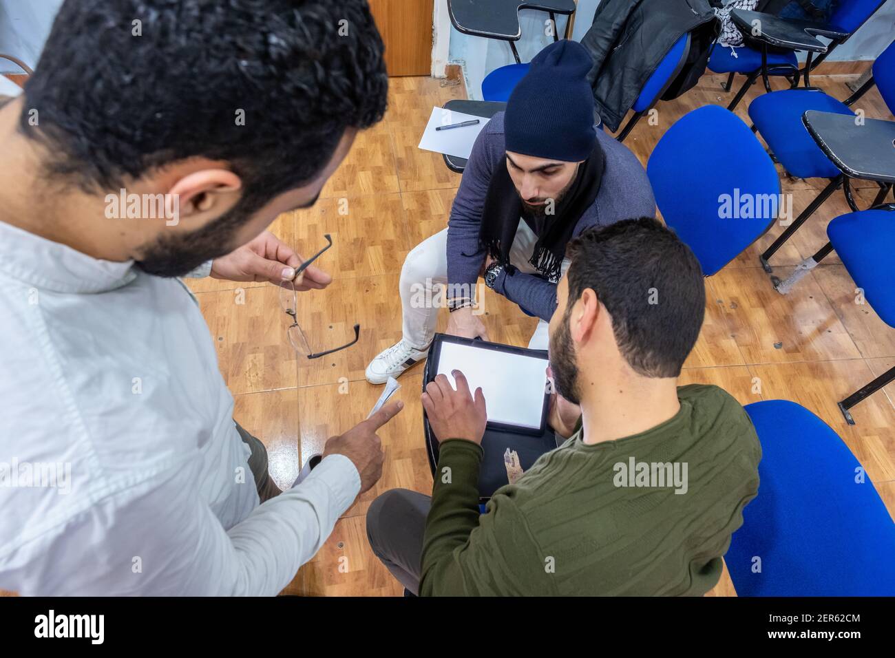 Arabic students discussing things in class Stock Photo
