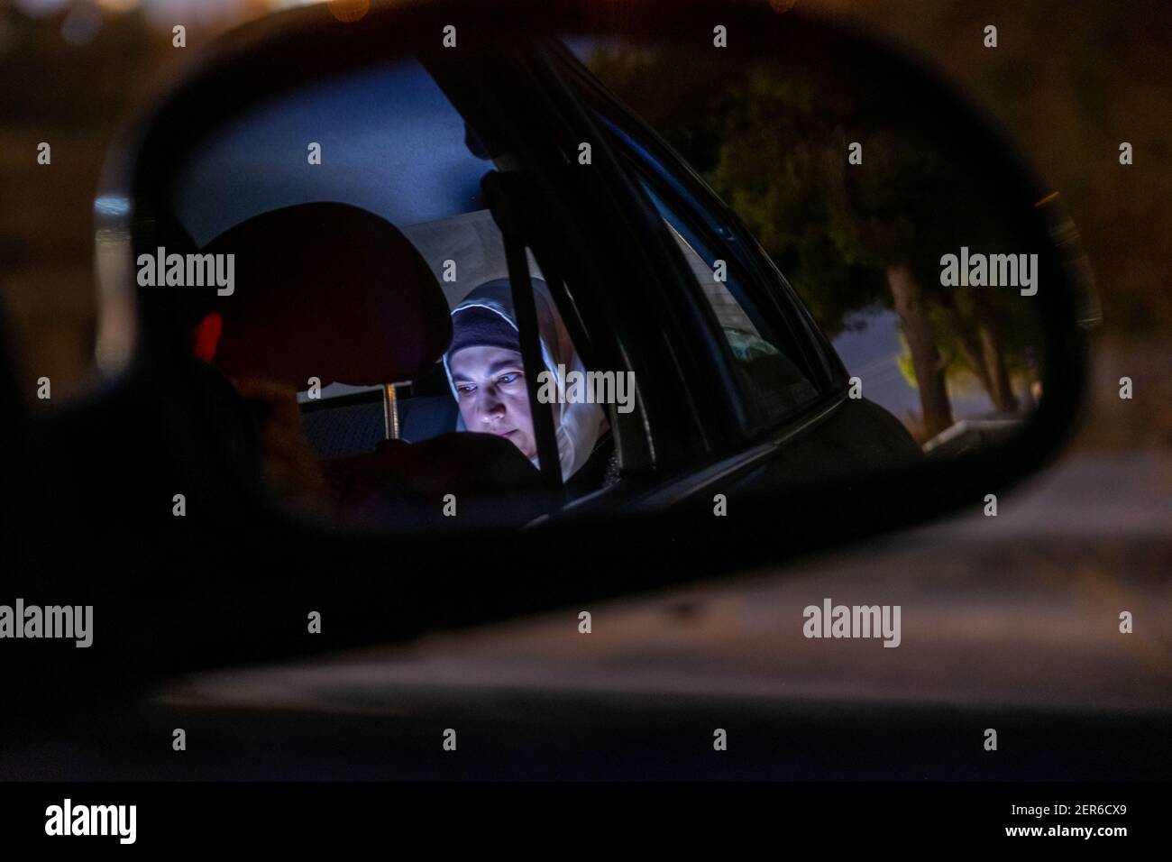 Muslim woman reflection in car side mirror at night Stock Photo Alamy