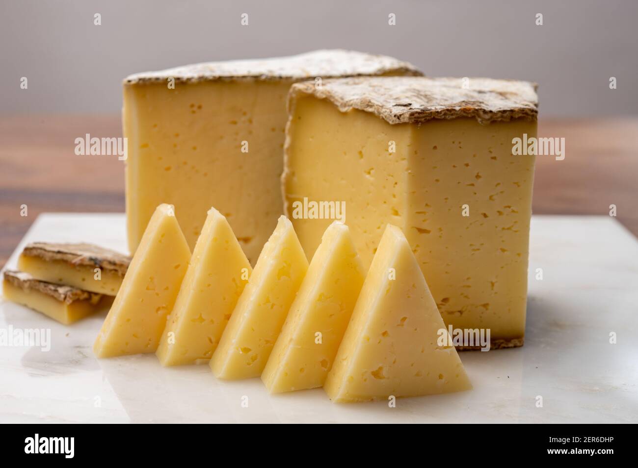 Cheese Tomme de Savoie cheese from Savoy region in French Alps, mild cow's milk cheese with beige interior and thick brownish-grey rind c Photo - Alamy