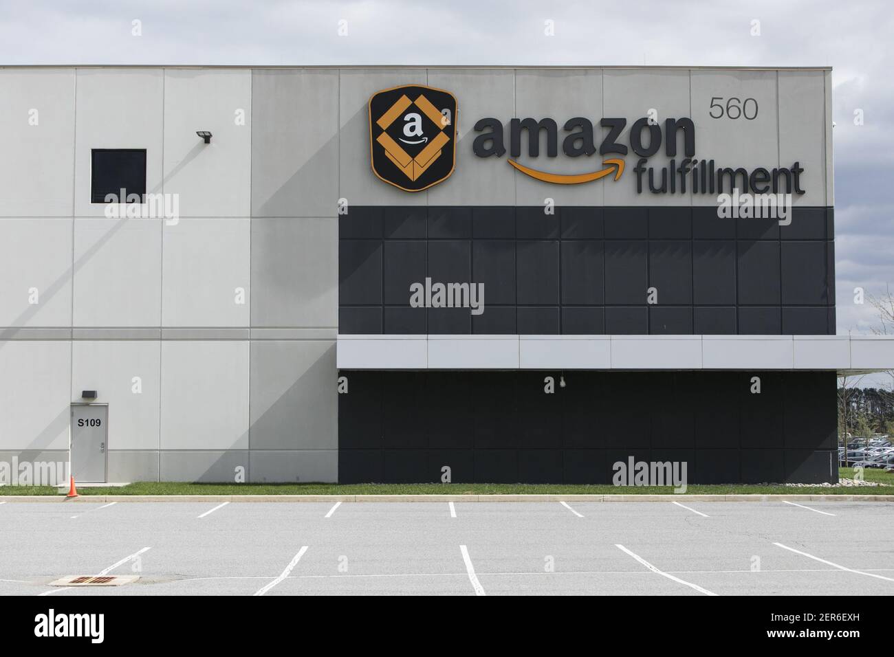A logo sign outside of a Amazon fulfillment center in Middletown