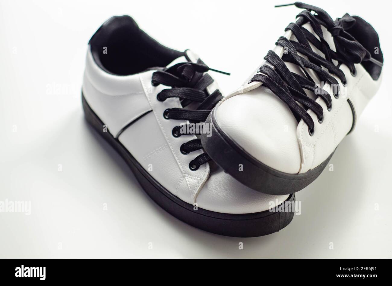 White sneakers with black laces, classic sports shoes, casual style Stock  Photo - Alamy