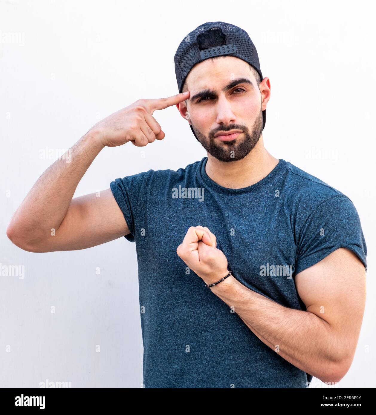 Guy pointing at his big strong hand muscle Stock Photo - Alamy