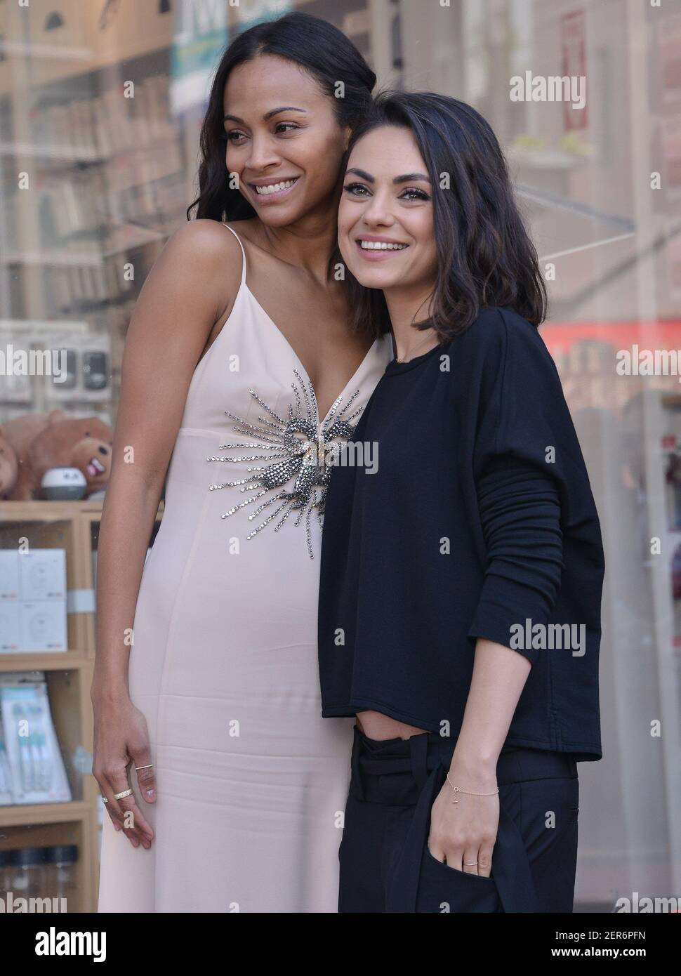 (L R) Zoe Saldana and Mila Kunis at the Zoe Saldana Star On The