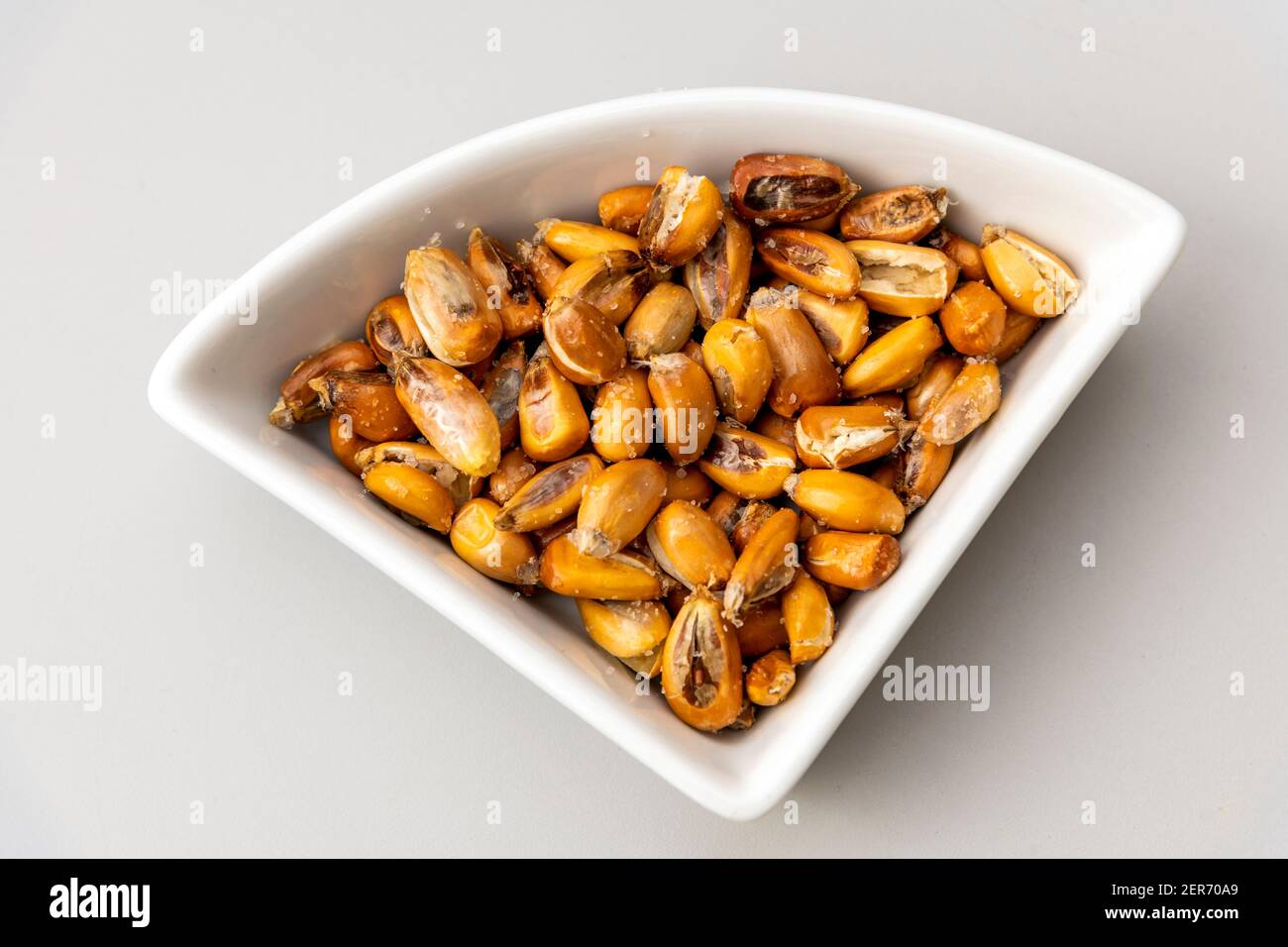 Peruvian corn nut known also as cancha served as a small appetizer plate Stock Photo