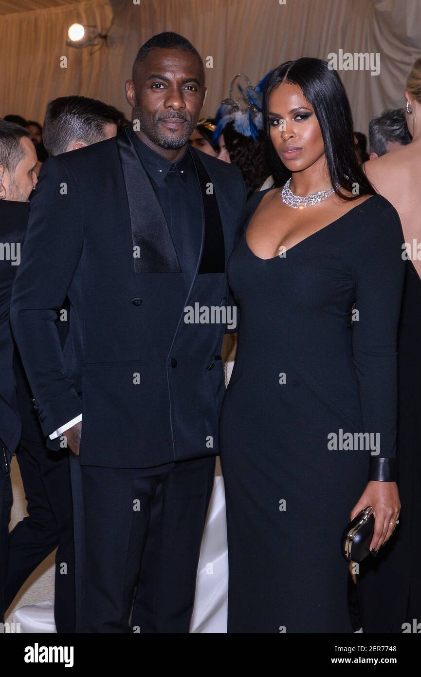 Idris Elba and Sabrina Dhowre walking on the red carpet at The