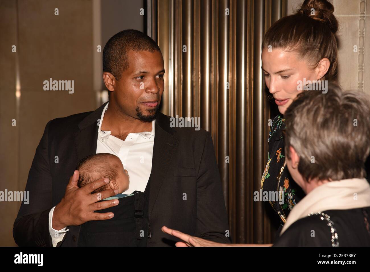 Damani Baker, Asa Baker Russell and Cameron Russell attend The