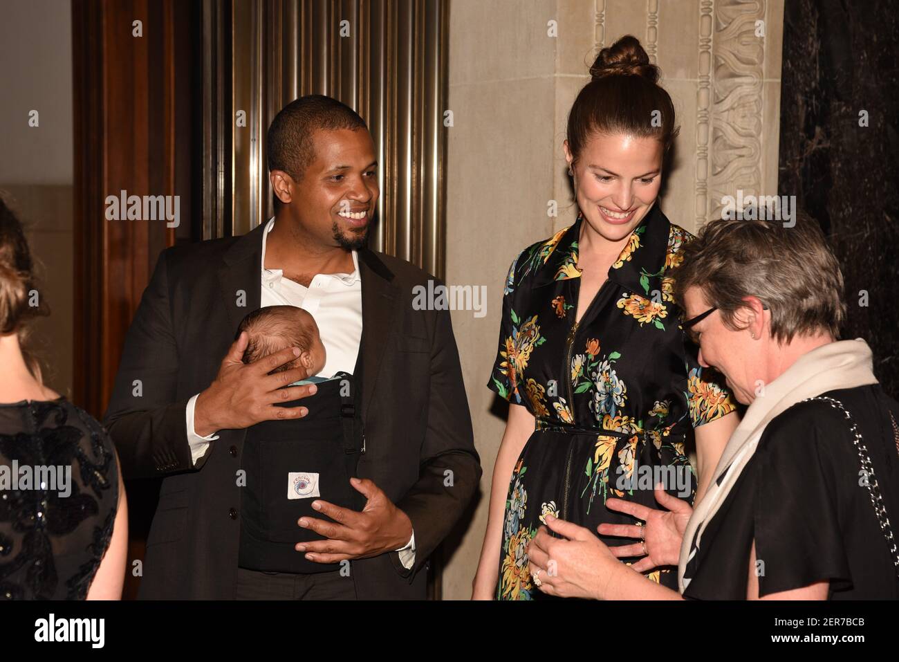Damani Baker, Asa Baker Russell and Cameron Russell attend The