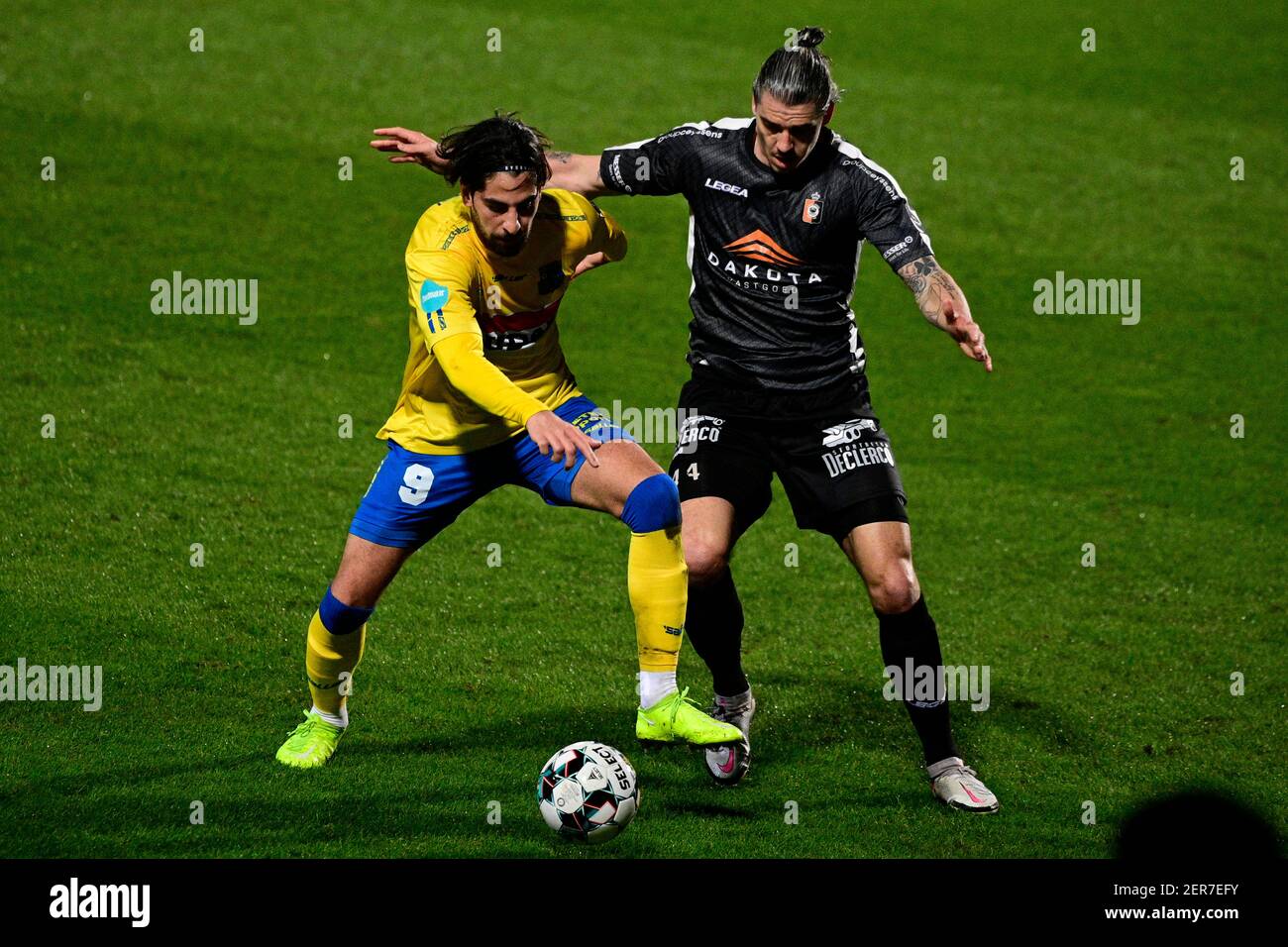 Westerlo's Atabey Cicek and Deinze's Seth De Witte fight for the ball during a soccer match between KVC Westerlo and KMSK Deinze, Sunday 28 February 2 Stock Photo