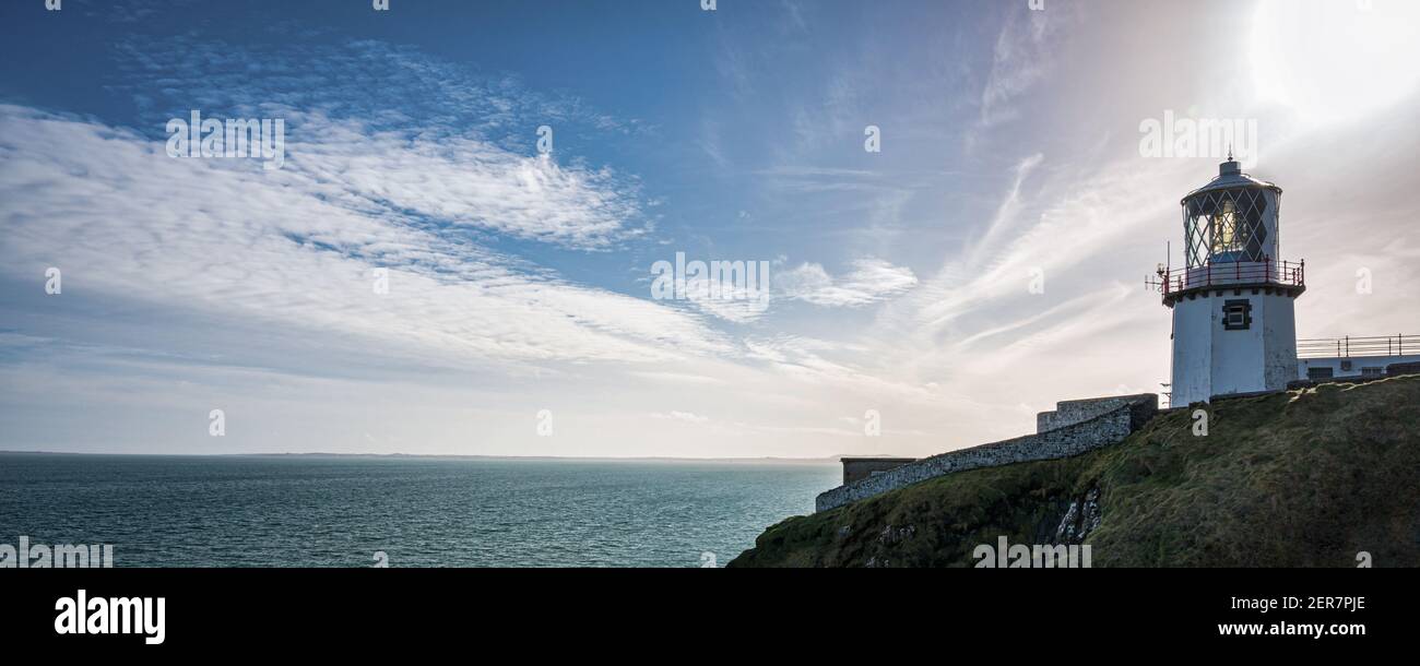 Blackhead Lighthouse high up on the coastal cliffs of Northern Ireland near the town of Whitehead Stock Photo