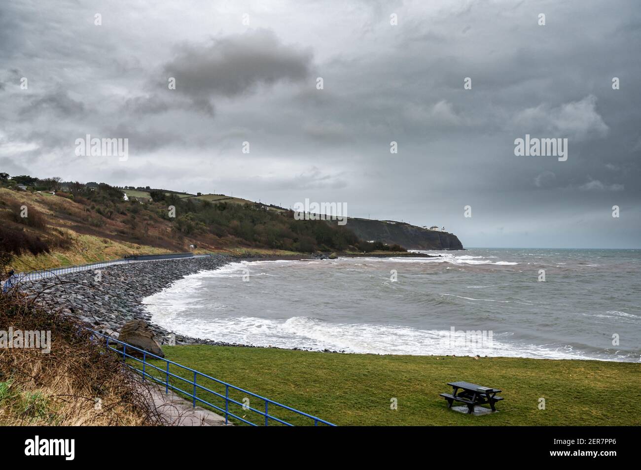 The Coast walk to Blackhead Lighthouse on a stormy winters day Stock Photo