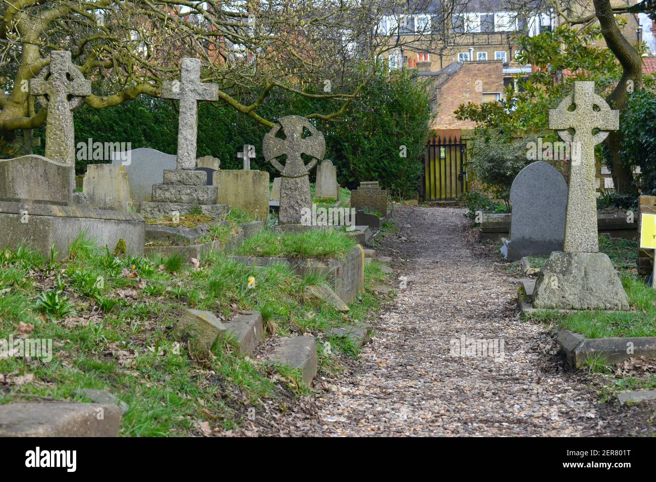 English churchyard gravestones of 19th and 20th century show how the carvings and symbols shifted from death to life after. Crosses angels became norm Stock Photo