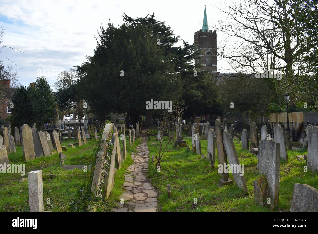Burial ground in churchyard with headstones facing east The graves are
