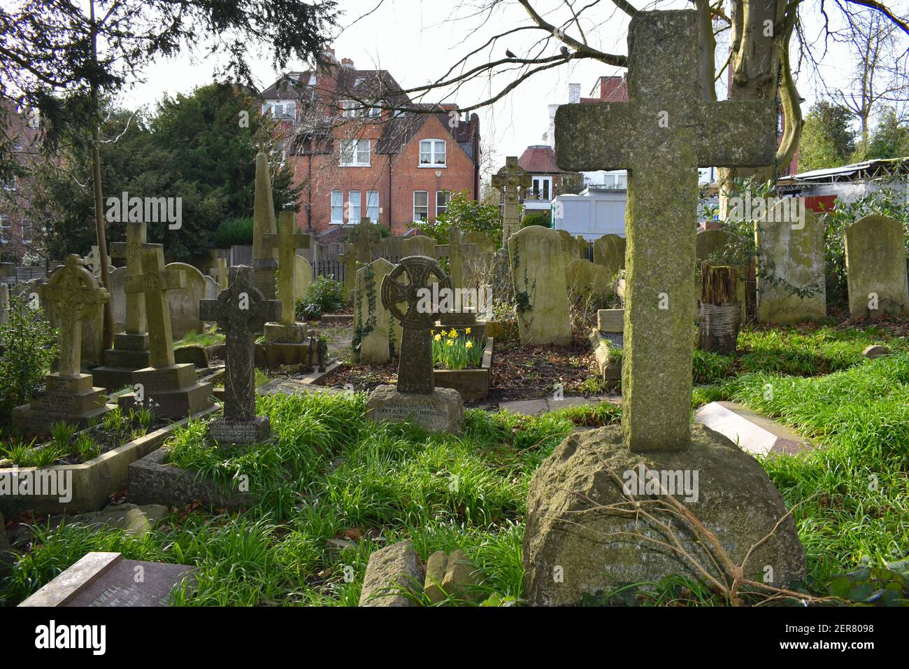 English churchyard extension closed for further burials but used for the interment of ashes after cremation Crosses and angels are traditional symbols Stock Photo