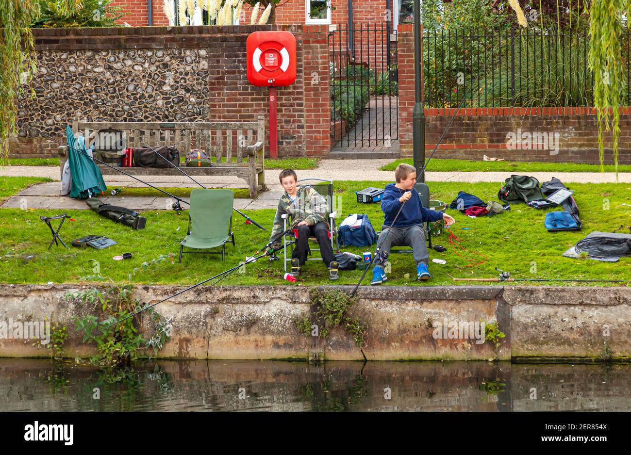 10-07-2012 Norwich, UK: Two teen boys are spending their time after