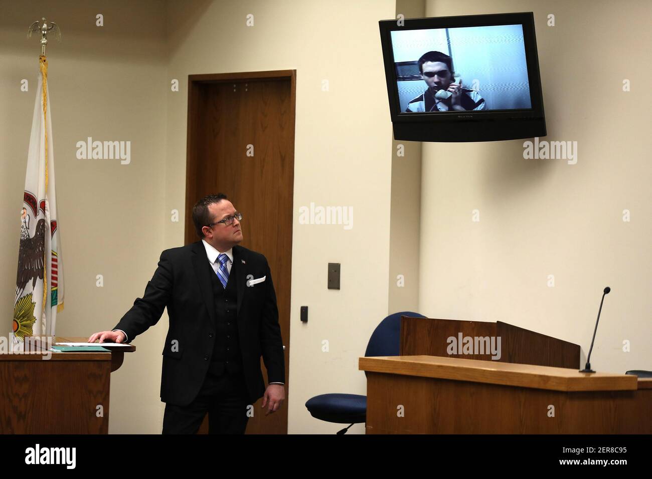 Lee County State's Attorney Matthew T. Klahn looks on as accused gunman Matthew Milby, making his appearance via video, is arraigned at the Lee County Courts Building in Dixon, Ill., on Friday, May 18, 2018. (Photo by Terrence Antonio James/Chicago Tribune/TNS/Sipa USA) Stock Photo