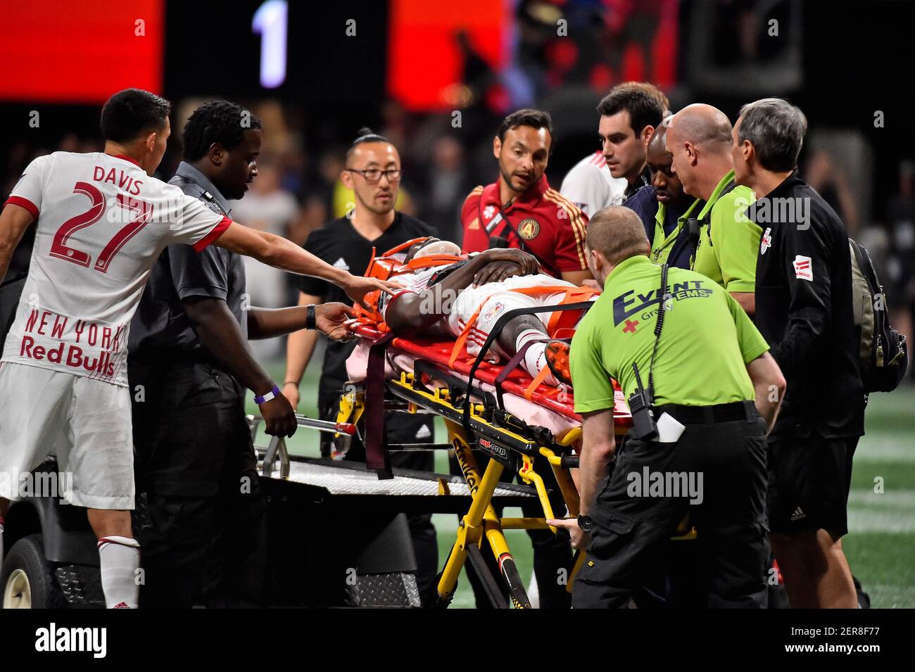 May 20, 2018; Atlanta, GA, USA; New York Red Bulls midfielder Sean Davis (27) reacts to New York Red Bulls defender Kemar Lawrence (92) as he is loaded on to the stretcher and carted off the field after being injured during the second half against the Atlanta United at Mercedes-Benz Stadium. Mandatory Credit: Jasen Vinlove-USA TODAY Sports Stock Photo