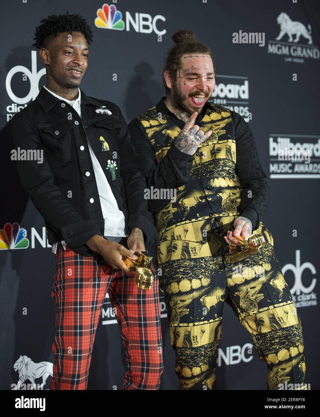 Recording artists 21 Savage (L) and Post Malone appear backstage after  winning the top Rap Song award for 'Rockstar,'' during the 2018 Billboard  Music Awards at MGM Grand Garden Arena on May