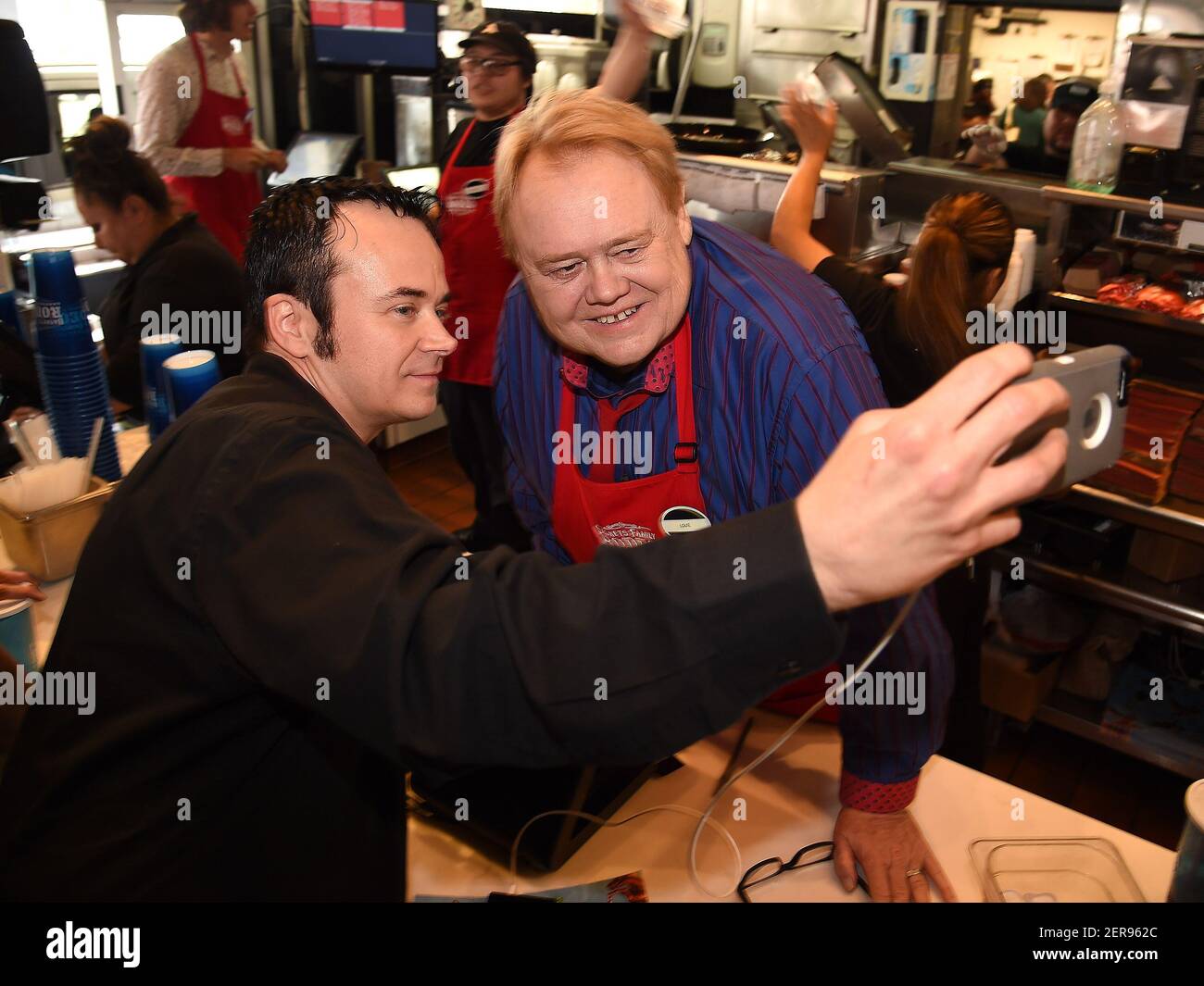 HOLLYWOOD, CA MAY 29 Louie Anderson works behind the counter at Arby's at the FYC event for