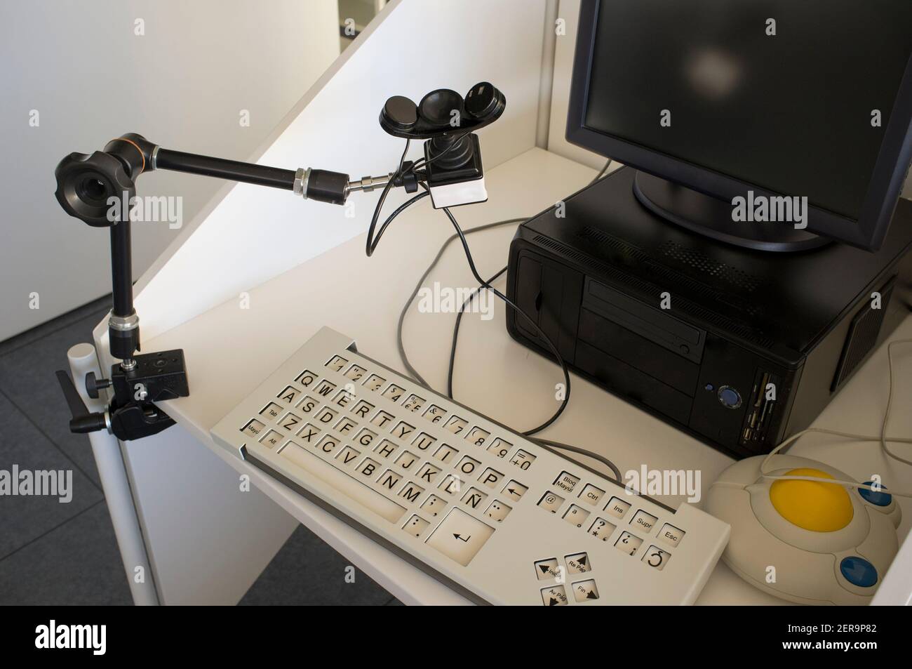 Computer for disabled users. It was equiped with alternate input devices like handsfree chin mouse, Adaptive keyboard and trackball Stock Photo
