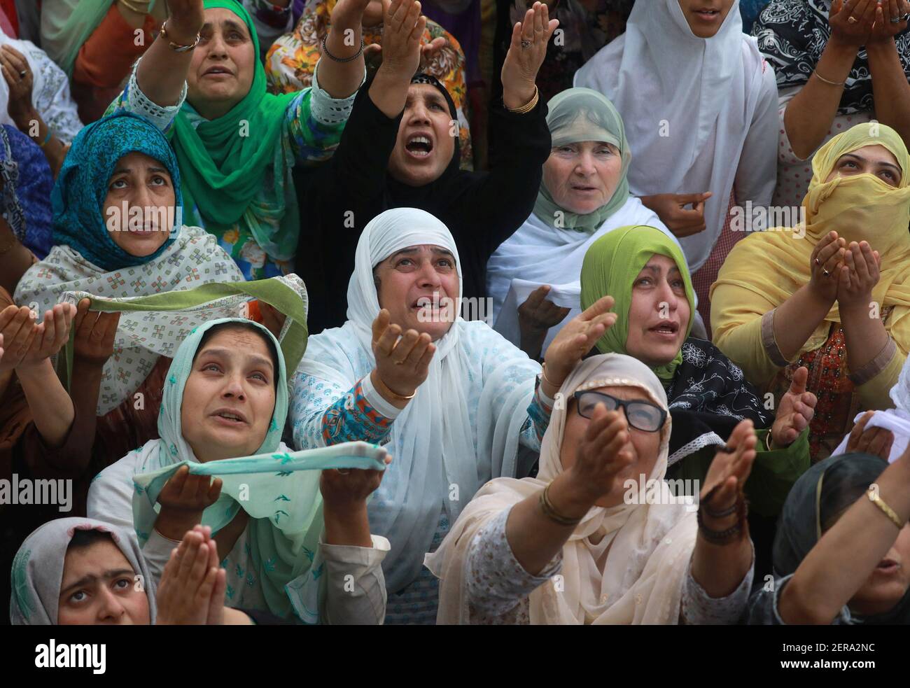 SRINAGAR, INDIA - JUNE 6: Kashmiri Muslim women prays as the head ...