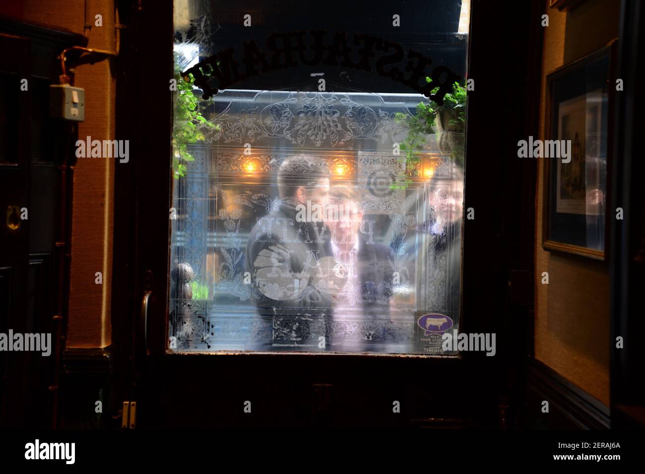Men drinking outside The Guinea pub, Mayfair, London Stock Photo