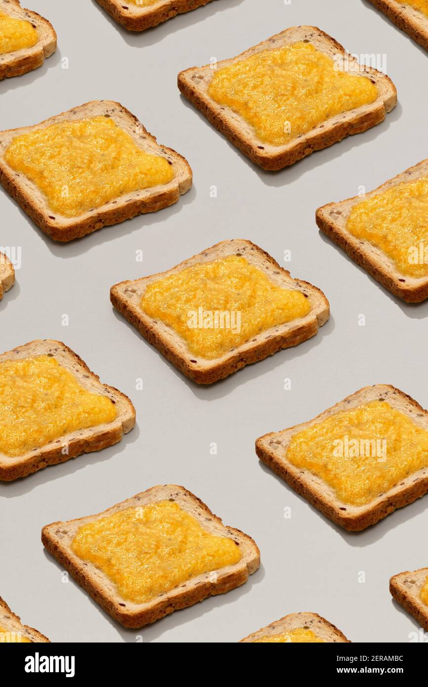 Pattern with toast and lemon jam on gray background Stock Photo