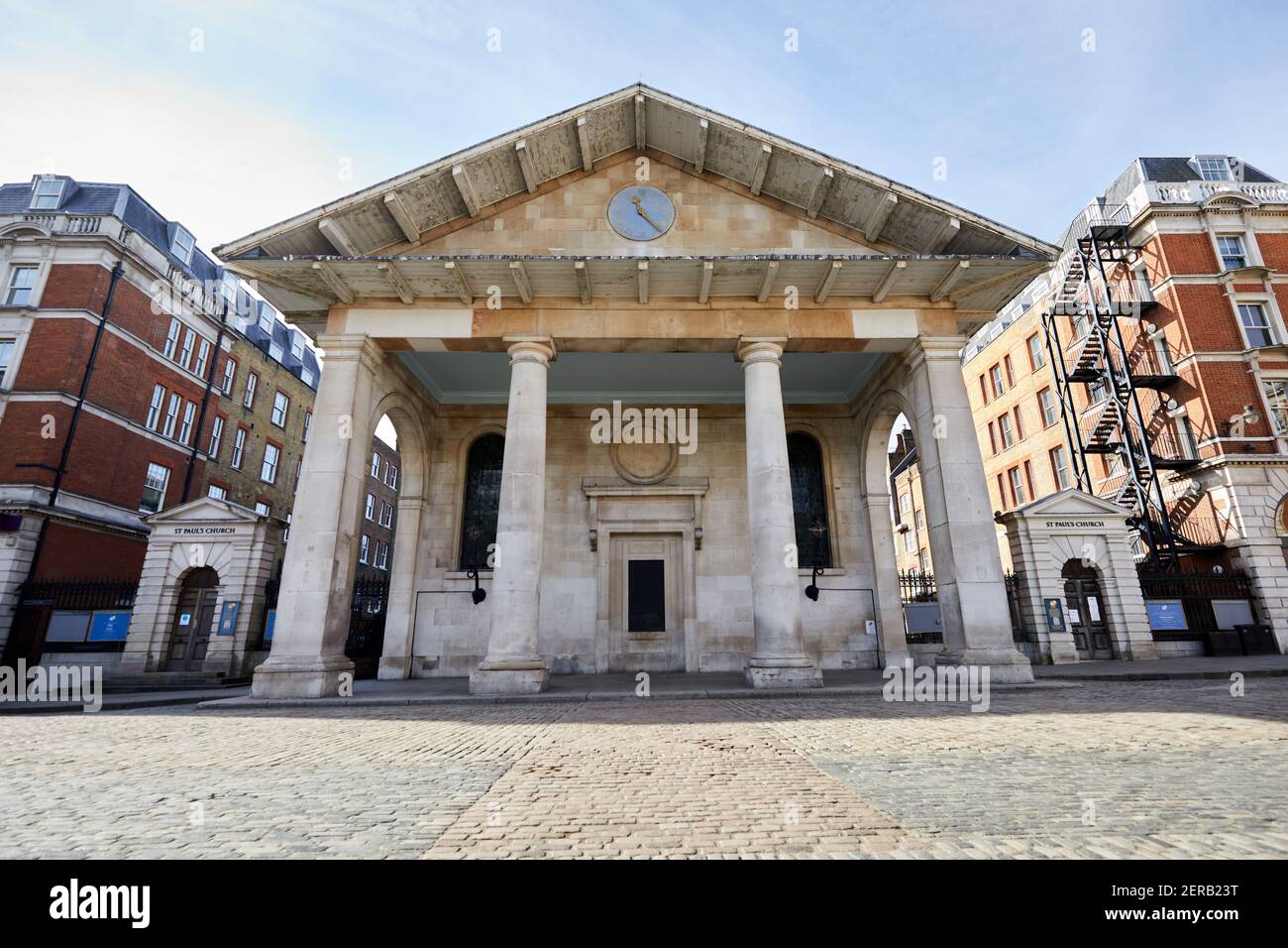 London, U.K. - 23 Feb 2021: The facade and front area of St. Paul's Church in Covent Garden. The space in front of the portico normally bustles with street entertainers and visitors but has been deserted during coronavirus lockdowns. Stock Photo