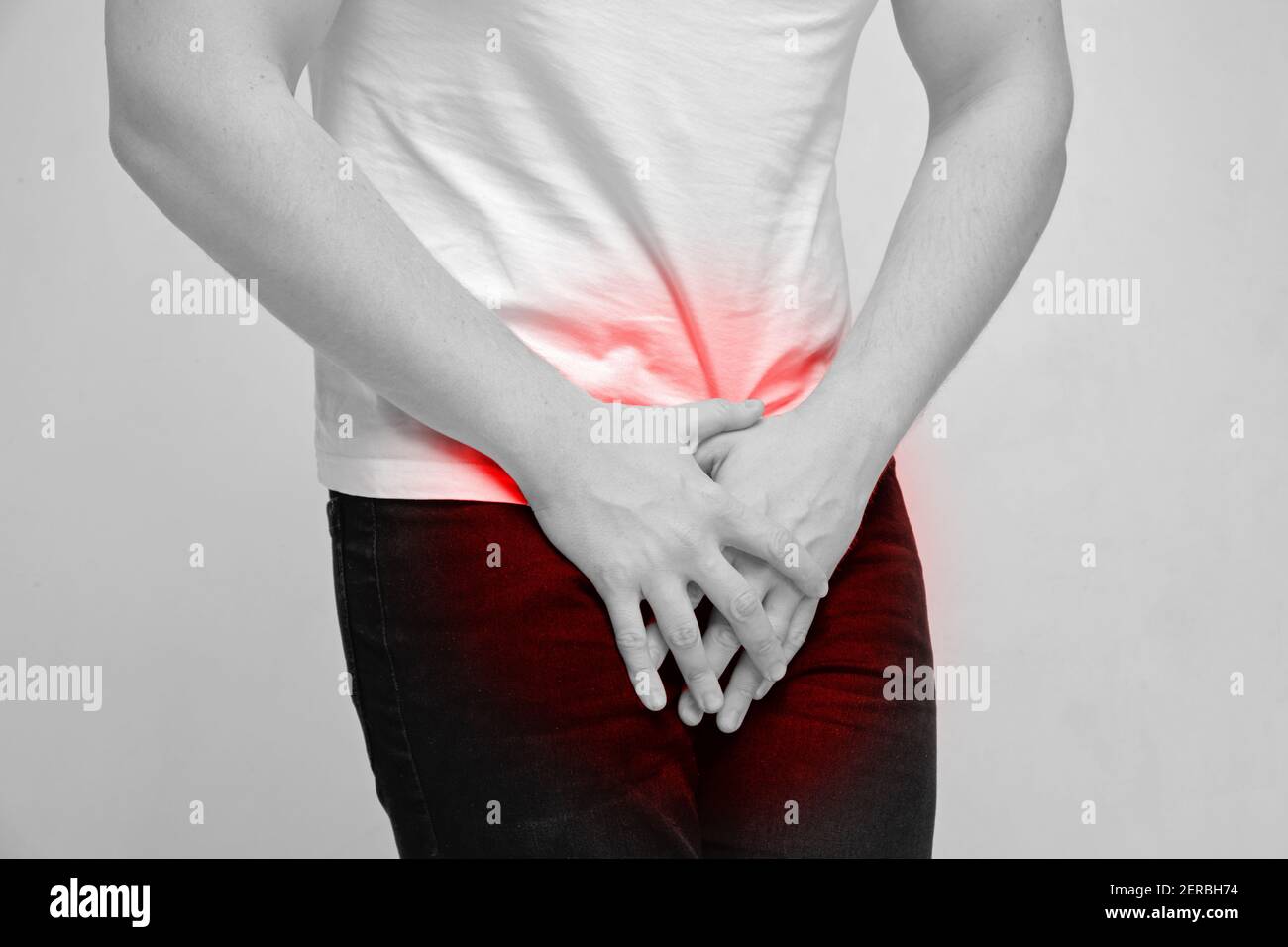 Person experiencing pain from prostate gland and urination. Stock Photo