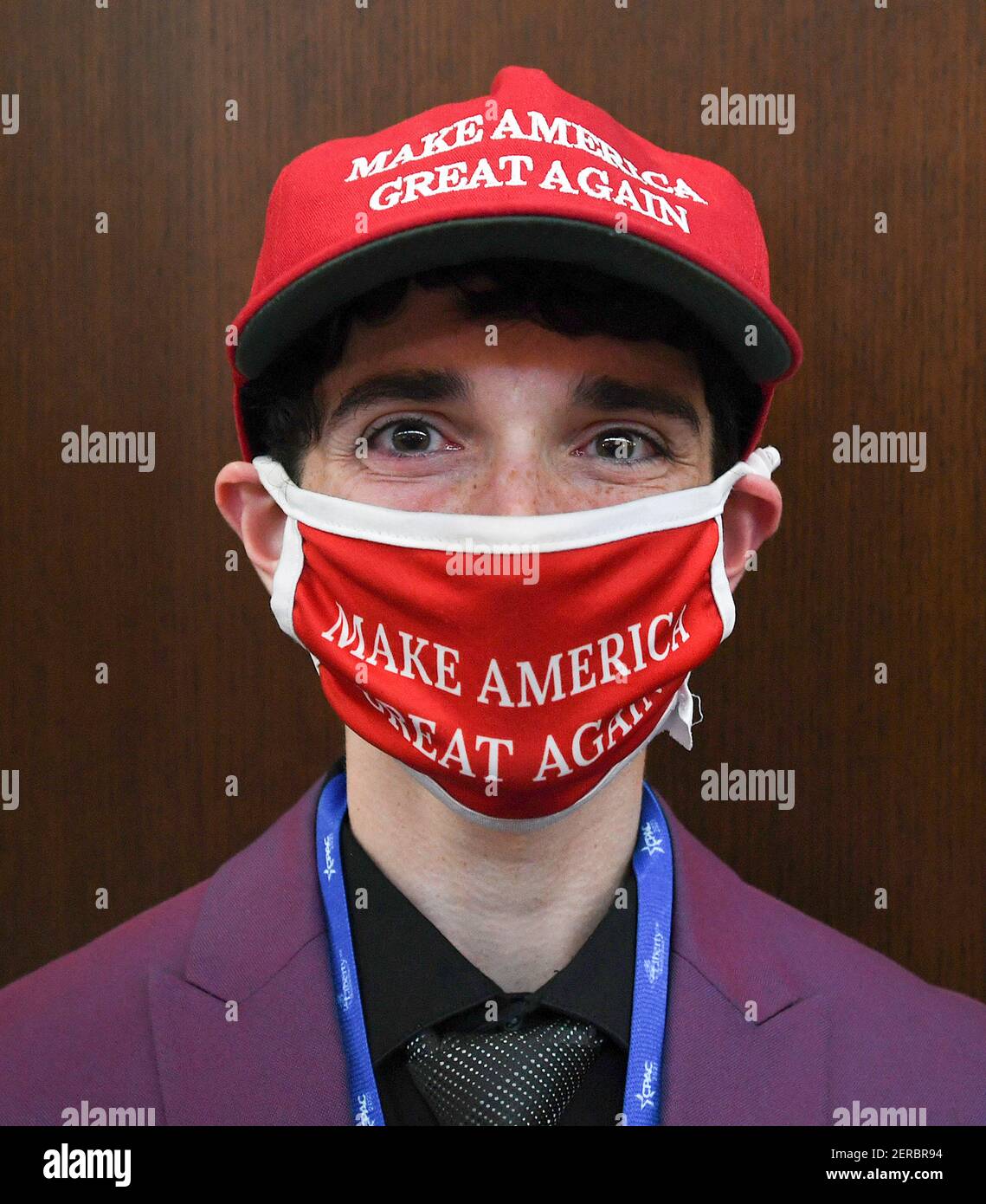 Eric Simon poses wearing a MAGA hat and face mask at the 2021 Conservative Political Action Conference at the Hyatt Regency.  Former U.S. President Donald Trump is scheduled to speak on the final day of the conference. Stock Photo