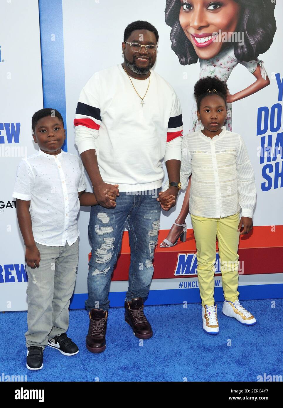 Actor Lil Rey Howery and children attend the world premiere of Uncle ...