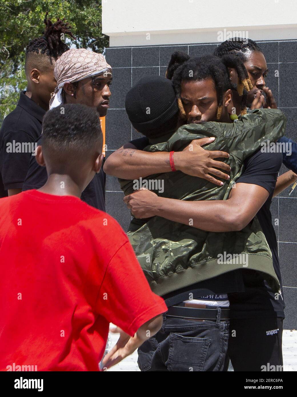 Rapper Denzel Curry hugs a fan outside the BB&T Center before the ...