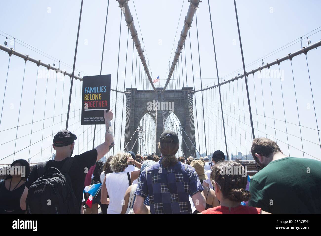 Protestors march across the Brooklyn Bridge during the march for National Day of Action: End Family Separation in New York, New York on June 30, 2018. Thousands of protestors marched from Foley Square over the Brooklyn Bridge to protest immigration raids across the country. (Photo by Erin Lefevre/Sipa USA) Stock Photo
