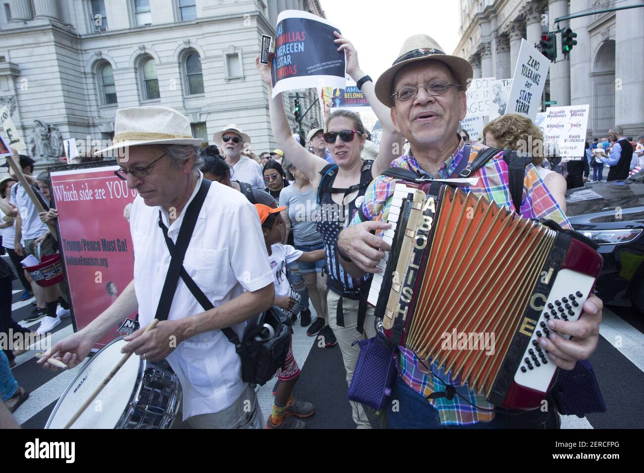 Protestors play instruments at the march for National Day of Action: End Family Separation in New York, New York on June 30, 2018. Thousands of protestors marched from Foley Square over the Brooklyn Bridge to protest immigration raids across the country. (Photo by Erin Lefevre/Sipa USA) Stock Photo