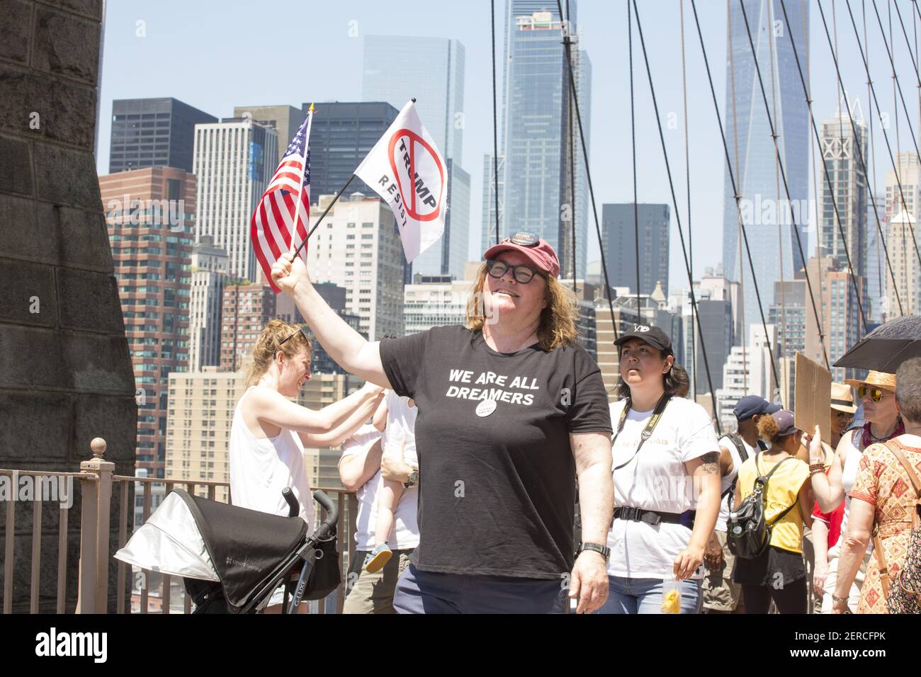 Protestors march across the Brooklyn Bridge during the march for National Day of Action: End Family Separation in New York, New York on June 30, 2018. Thousands of protestors marched from Foley Square over the Brooklyn Bridge to protest immigration raids across the country. (Photo by Erin Lefevre/Sipa USA) Stock Photo