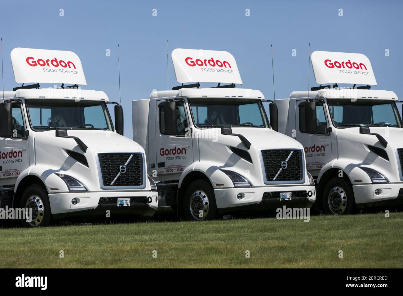 Semi trucks and trailers featuring Gordon Food Service logos outside of