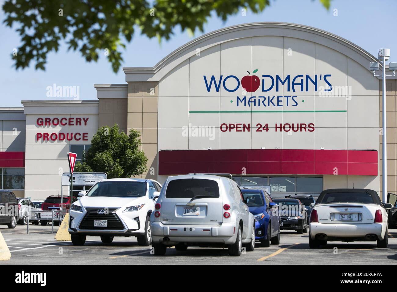A logo sign outside of a Woodman's Markets grocery retail store in