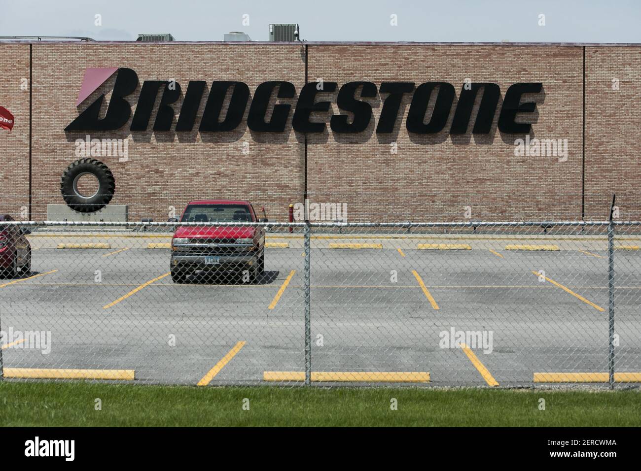 A logo sign outside of the Bridgestone Firestone agricultural tire