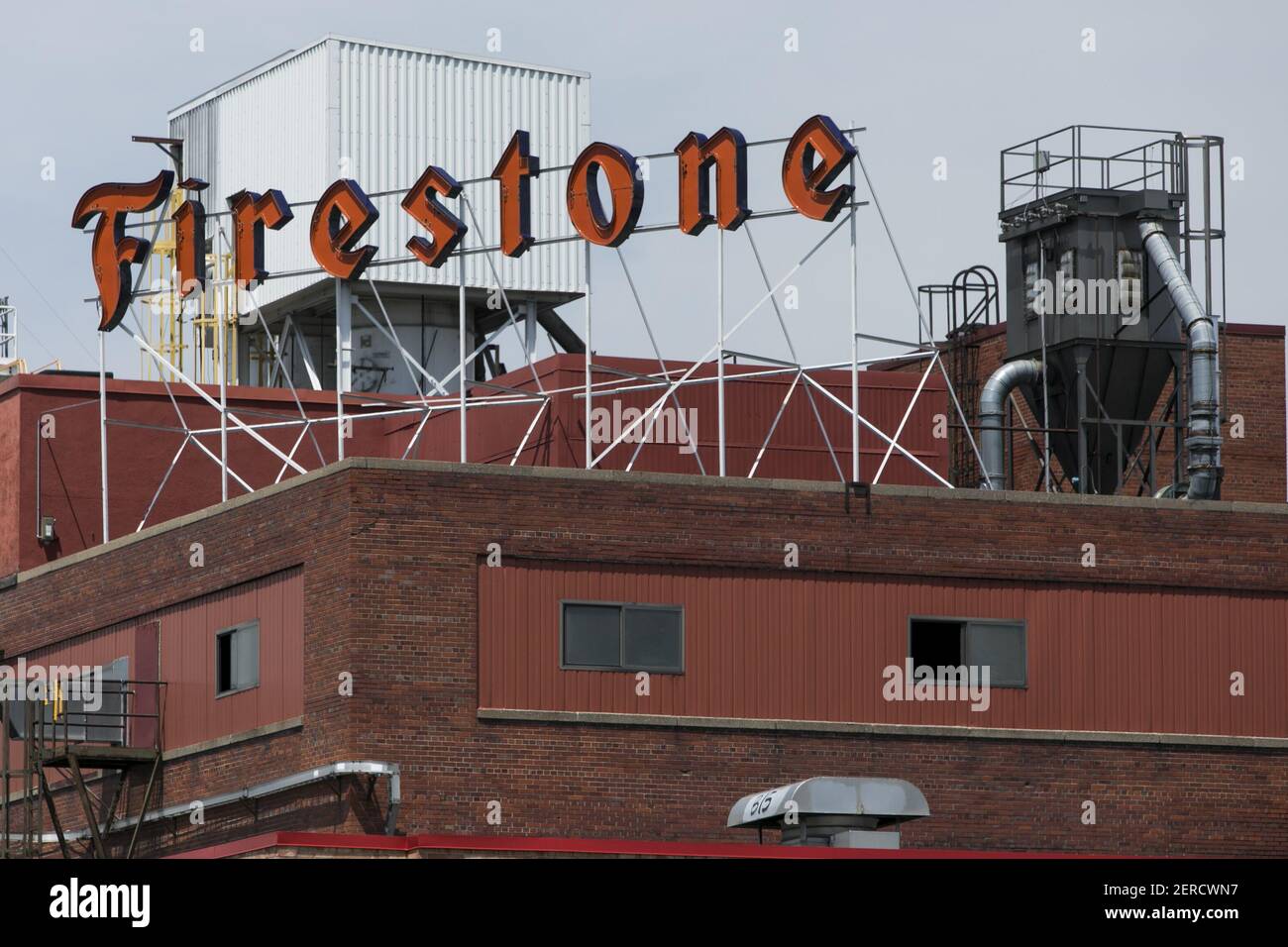A logo sign outside of the Bridgestone Firestone agricultural tire