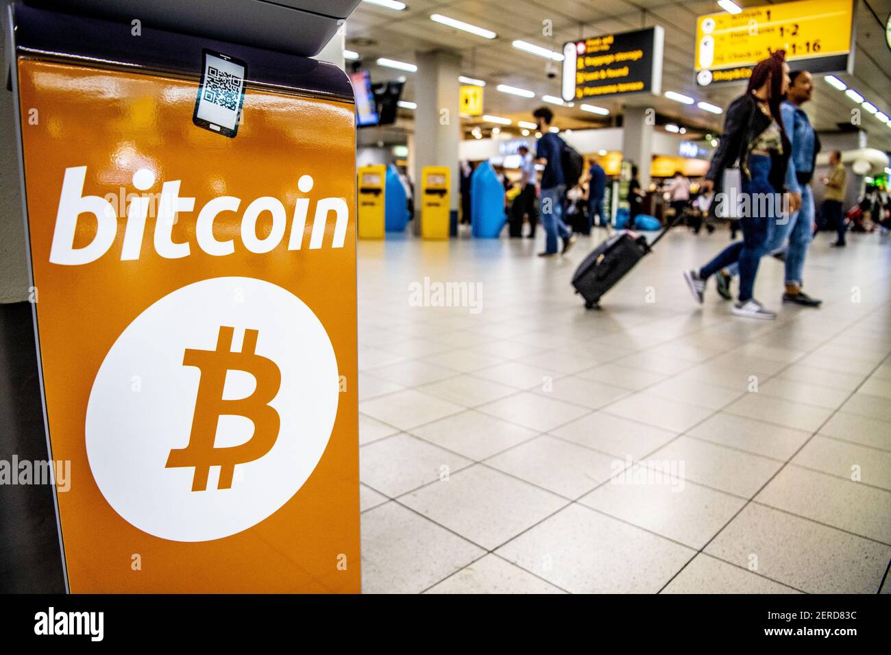 Travelers at Schiphol who wish to spend their last euros shortly before  departure can exchange these for bitcoin and ethereum cryptocurrences in  Amsterdam, Netherlands on June 20, 2018. A bitcoin machine was