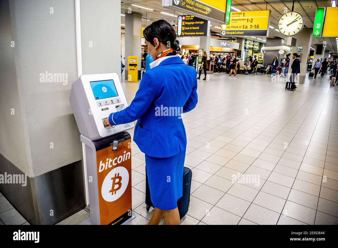 Travelers at Schiphol who wish to spend their last euros shortly before  departure can exchange these for bitcoin and ethereum cryptocurrences in  Amsterdam, Netherlands on June 20, 2018. A bitcoin machine was