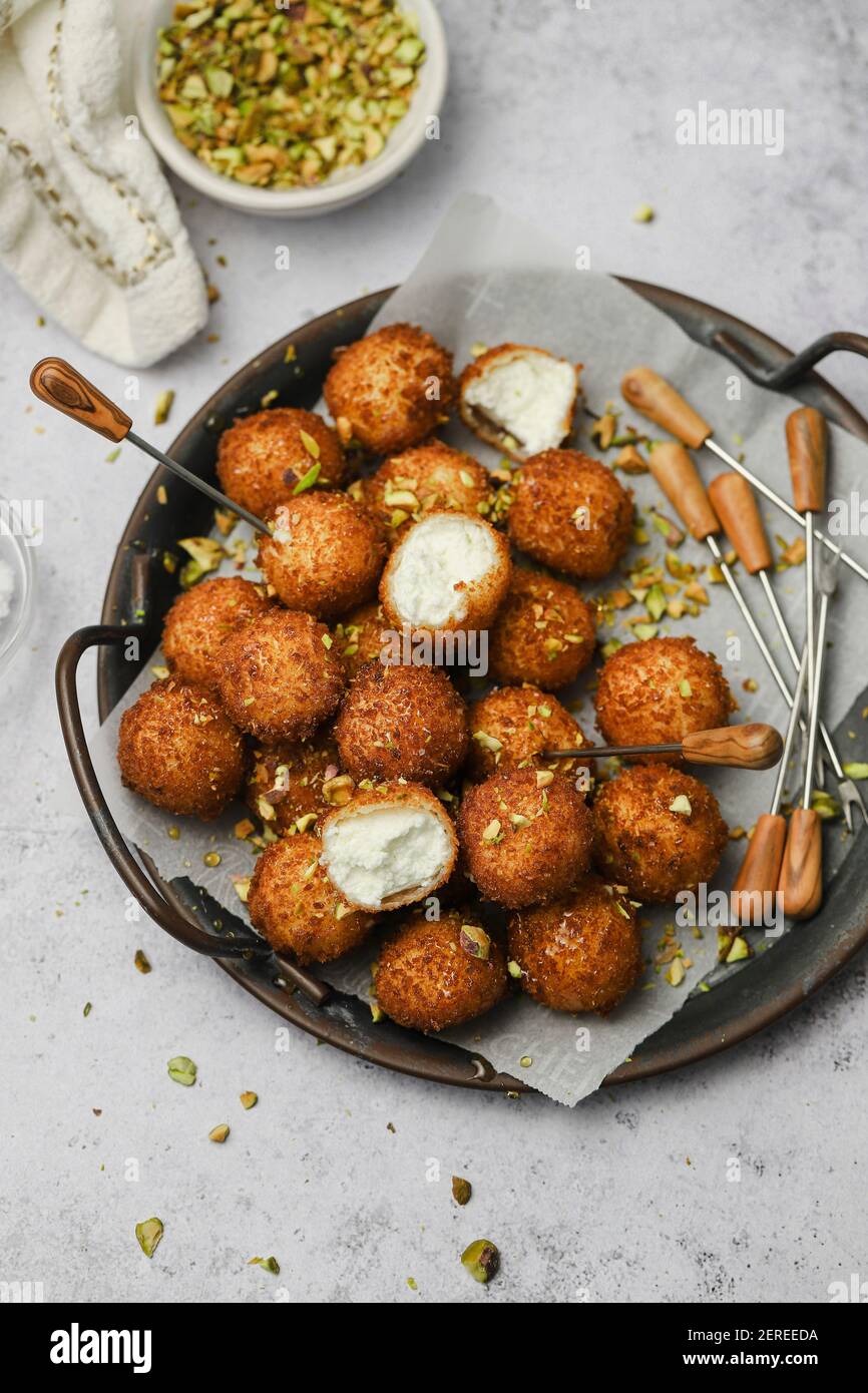 fried goat cheese balls with pistachios and truffle honey Stock Photo Alamy