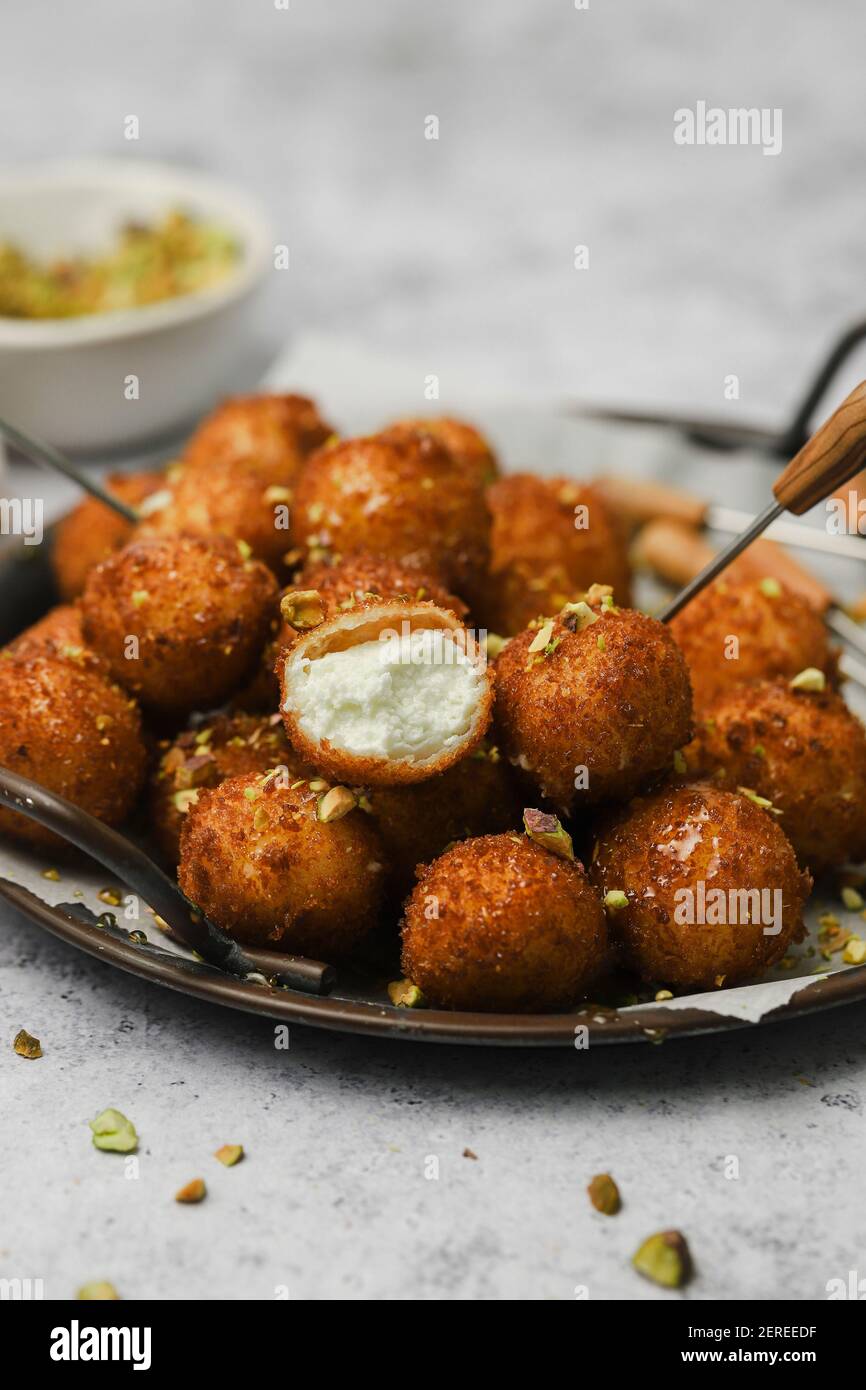 fried goat cheese balls with pistachios and truffle honey Stock Photo Alamy
