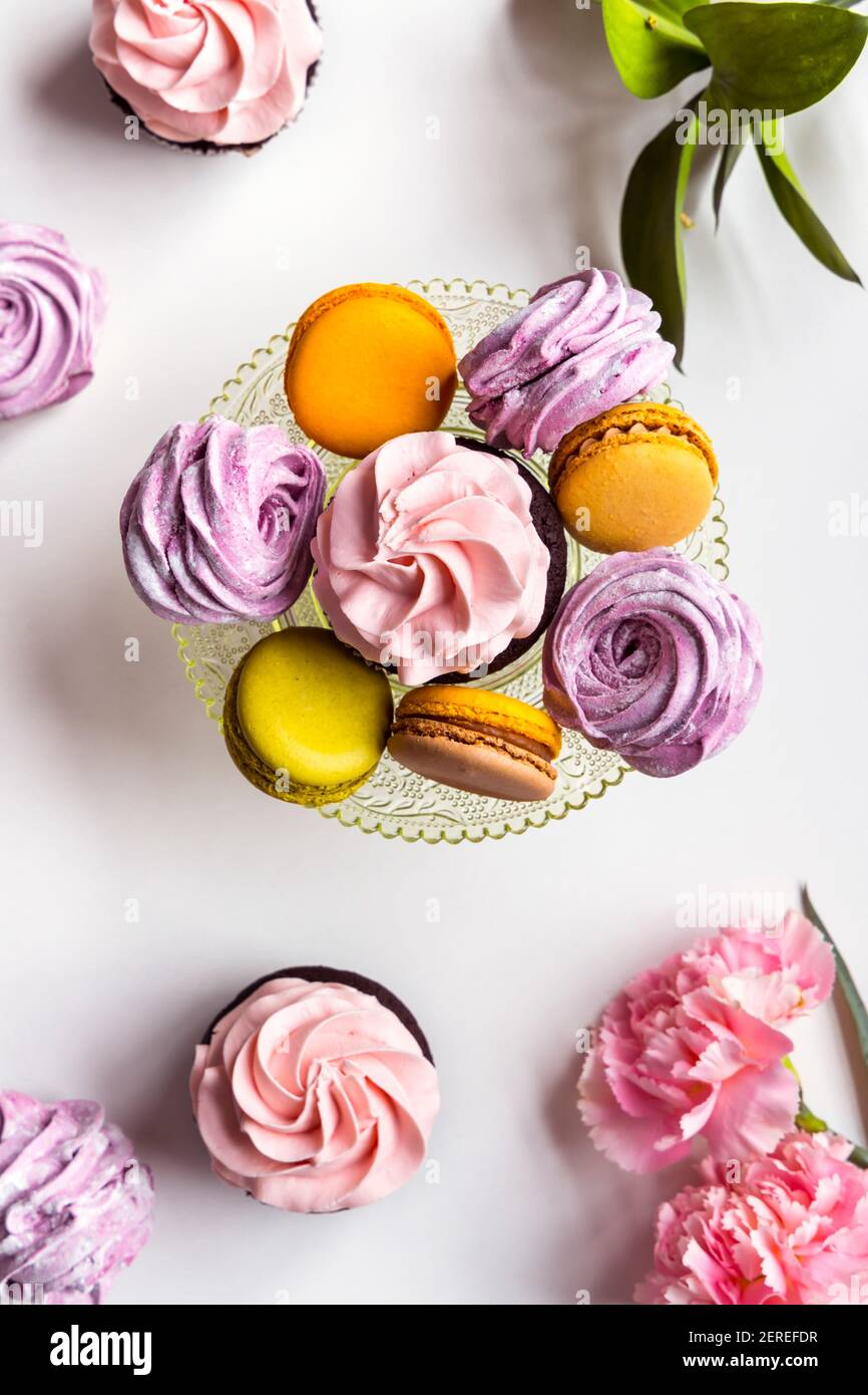 Cupcakes, macarons and marshmallows. Stock Photo