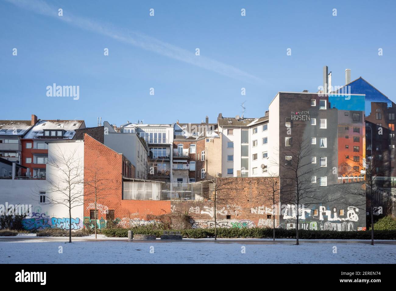 Outdoor sunny view at Berty-Albrecht-Park covered by snow and surround with modern residential and office building in winter season. Stock Photo