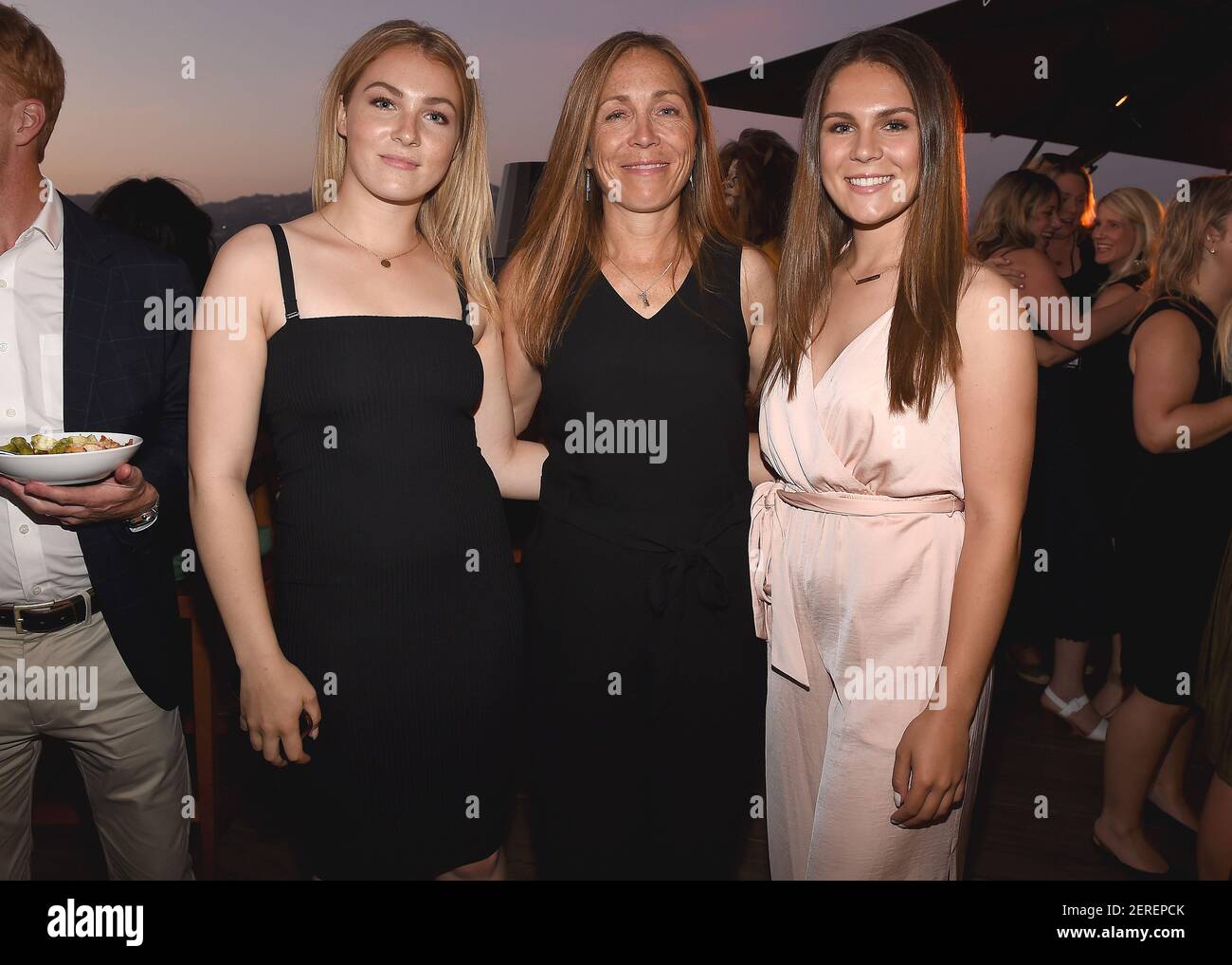 BEVERLY HILLS - JULY 24: Dr. Michelle Oakley (center) and daughters at  National Geographic's 'Summer TCA Kickoff Party' at The Rooftop by JG at  the Waldorf Astoria on July 24, 2018 in
