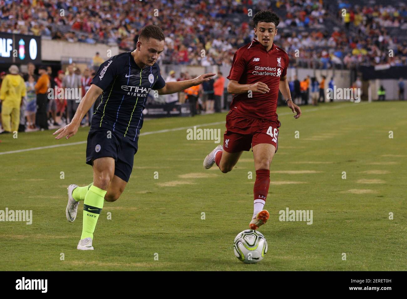 Jul 25, 2018; East Rutherford, NJ, USA; Manchester City forward Luke Bolton (74) and Liverpool midfielder Curtis Jones (48) fight for the ball during the first half of an International Champions Cup soccer match at MetLife Stadium. Mandatory Credit: Brad Penner-USA TODAY Sports Stock Photo