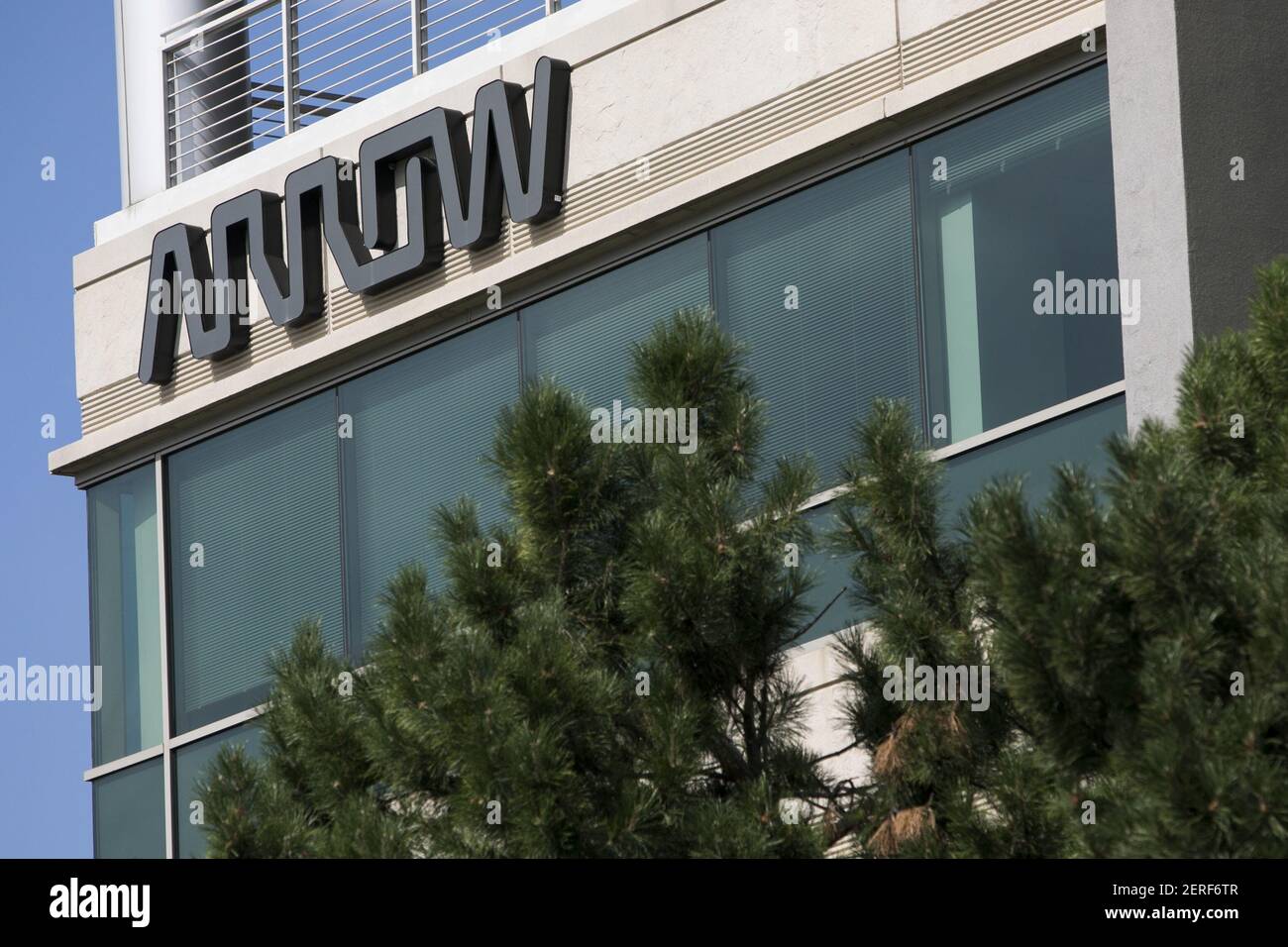 A logo sign outside of the headquarters of Arrow Electronics in