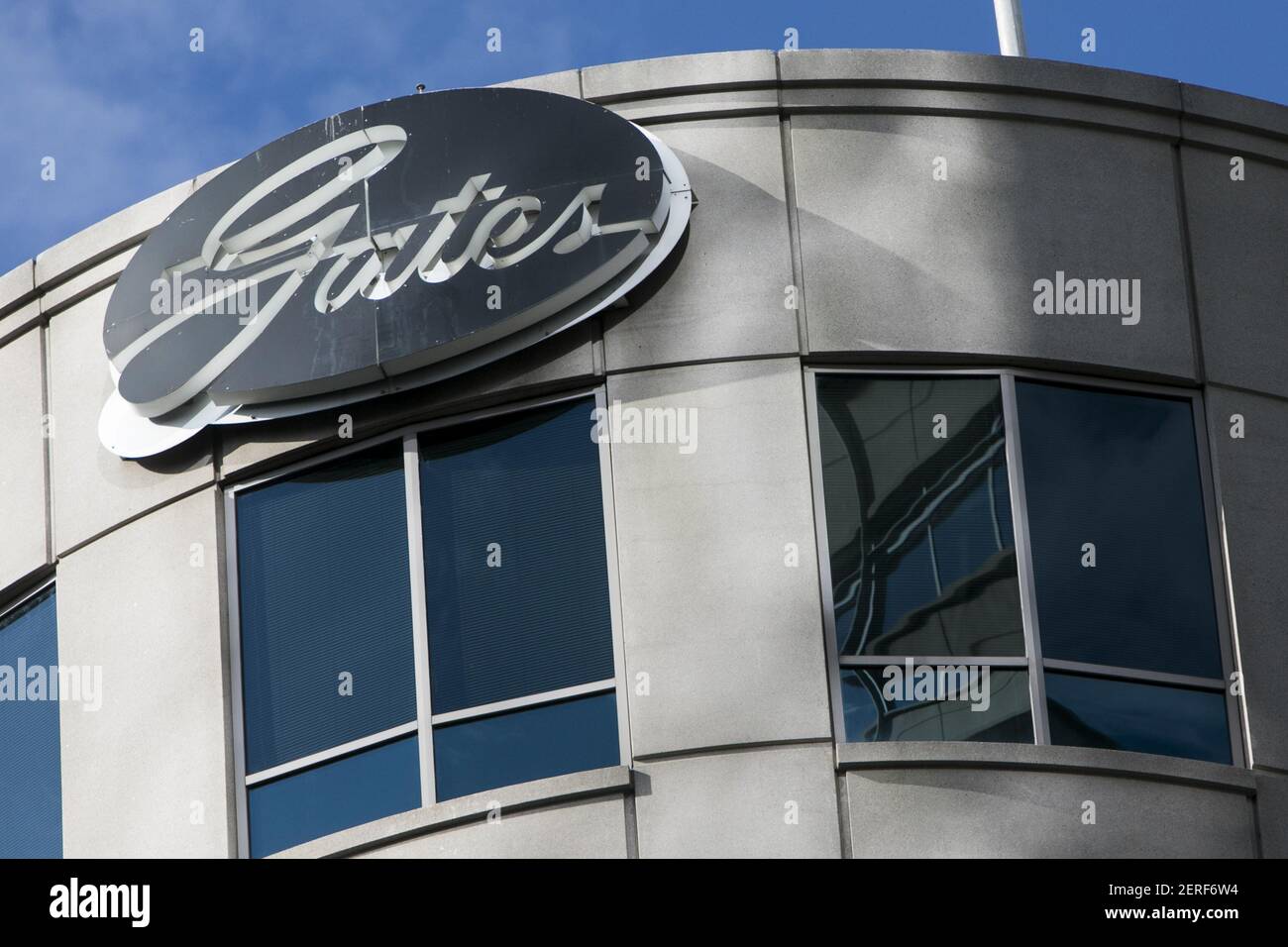 A logo sign outside of the headquarters of the Gates Corporation in