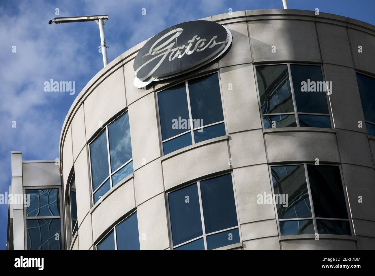 A logo sign outside of the headquarters of the Gates Corporation in
